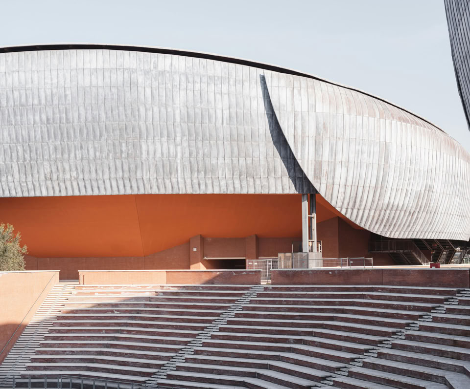 Explore the modern architecture of Parco della Musica in Rome, Italy, with its ribbed facade and bold design.